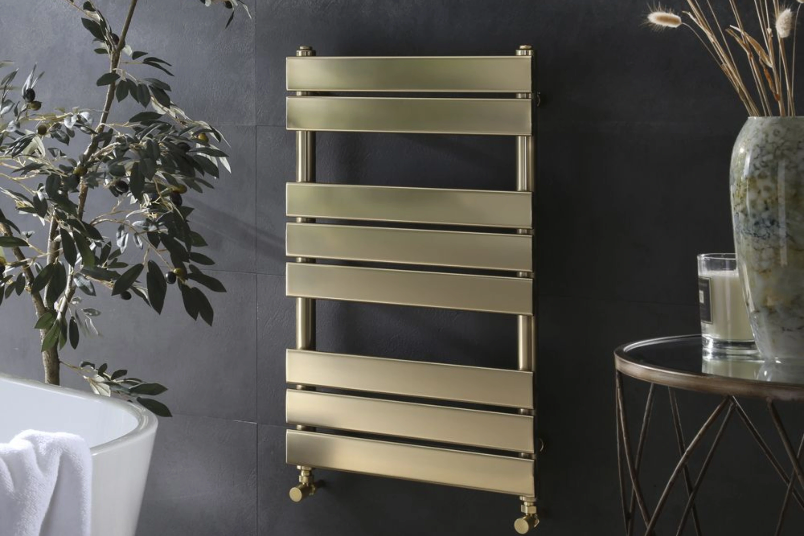 Brushed Brass Heated Towel Radiator Wall Hung In Bathroom